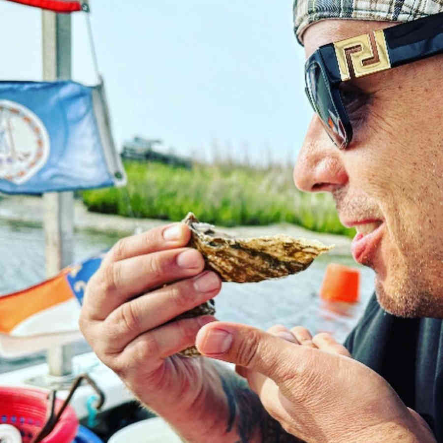 Man eating oyster